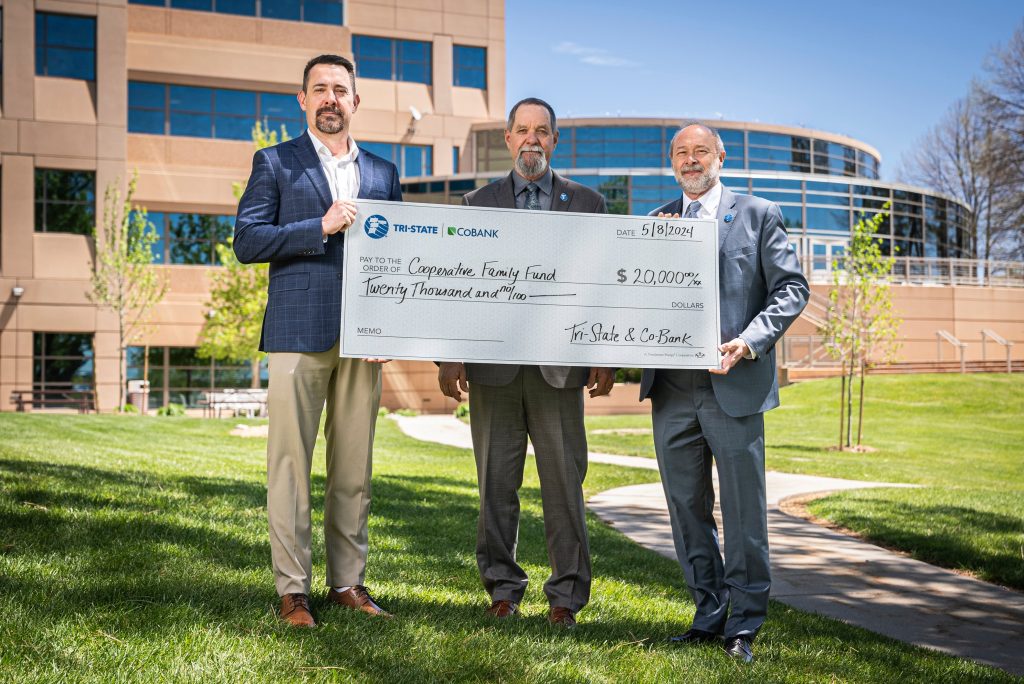 From left to right: Ken Krebs, CoBank vice president, Rural Infrastructure Banking Group; Tim Rabon, Tri-State chair and trustee of Otero County Electric Cooperative; and Duane Highley, Tri-State chief executive officer holding check of $20,000